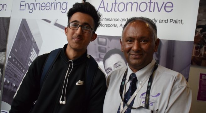 Male automotive student pictured with male automotive teacher