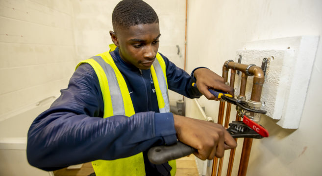 Plumbing student in workshop