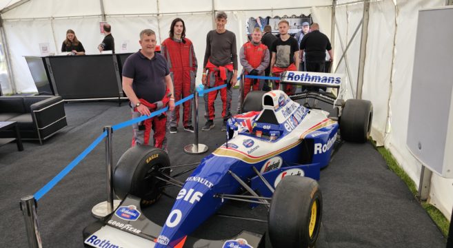 Staff and students with F1 car