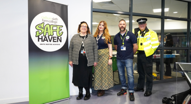 Staff at Cadbury College and West Midlands Police standing next to a Safe Haven banner