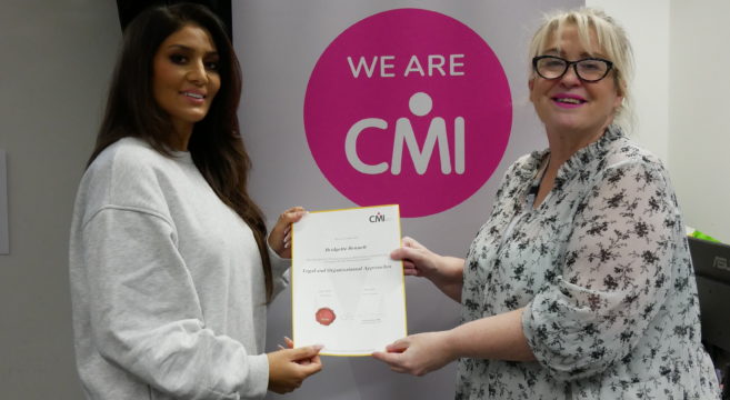 CMI student Nisha presented with certificate by tutor Bridgette Bennett